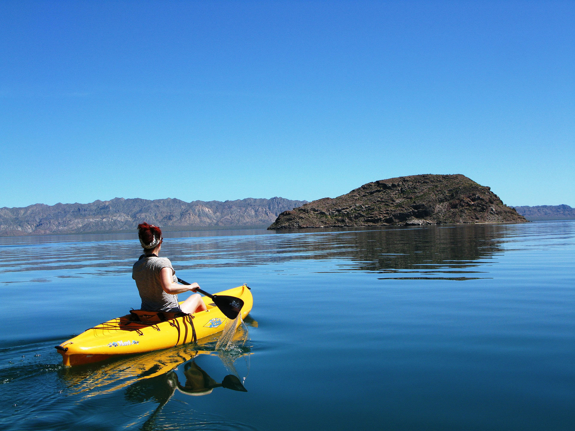 Female adventure speaker Lois Pryce paddling in Baja Mexico