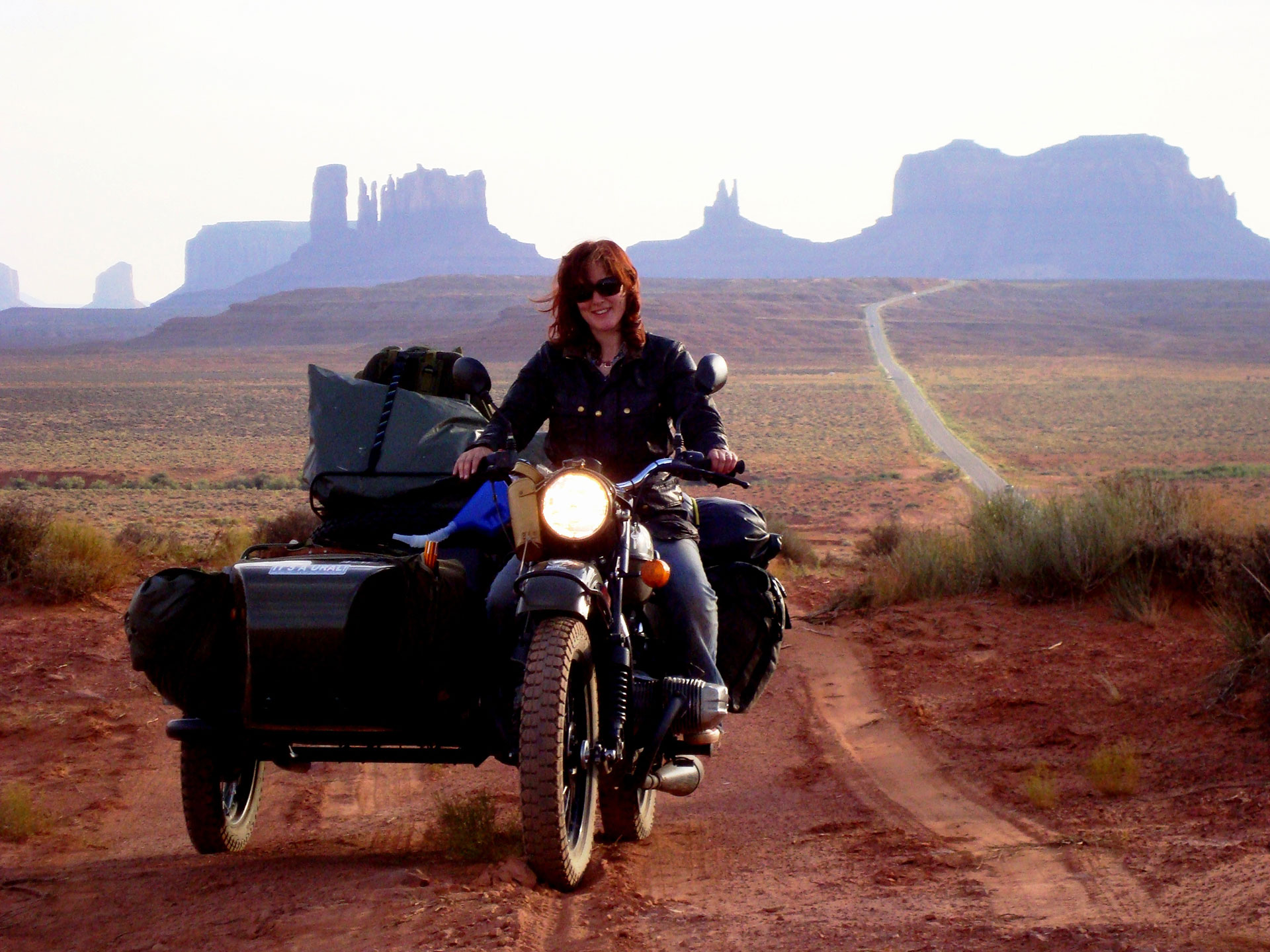 Lois Pryce on a motorbike ad sidecar in the USA