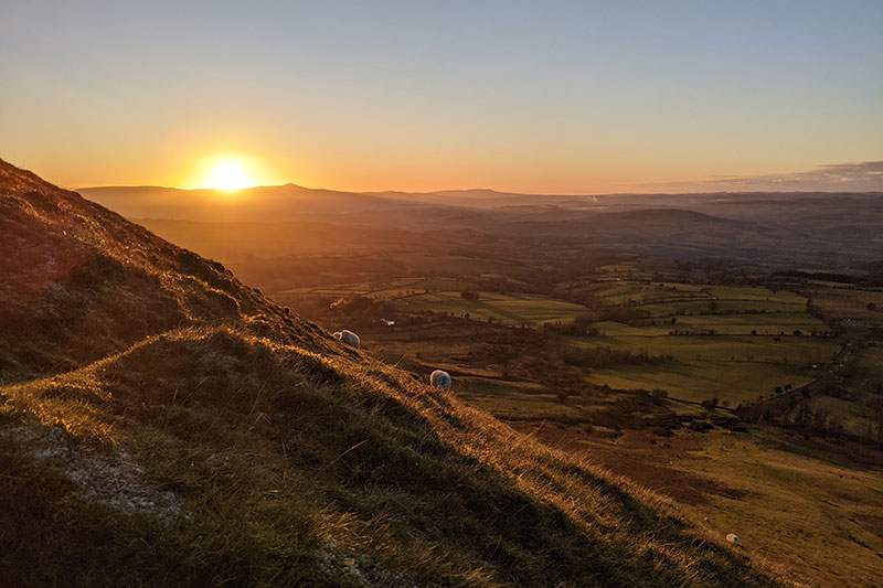 Sunset over the Black Mountains in Wales where woman travel writer Lois Pryce is teaching a writing course